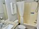 Bathroom with a tub and shower combo, decorative mirror, and granite vanity at 9790 66Th N St # 321, Pinellas Park, FL 33782