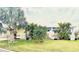 Charming single-story home with mature trees, lush lawn, and colorful potted plants for a vibrant curb appeal at 9790 66Th N St # 321, Pinellas Park, FL 33782