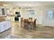 Open concept kitchen and dining area with modern appliances and a dining table for four at 9790 66Th N St # 321, Pinellas Park, FL 33782