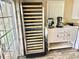 A wine cooler and appliances are conveniently located near the breakfast bar at 9790 66Th N St # 321, Pinellas Park, FL 33782