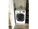 Bright laundry area features a modern, front-load washing machine and convenient utility connections at 9790 66Th N St # 321, Pinellas Park, FL 33782