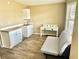 Room offering a kitchenette, desk, and futon for flexible living and sleeping at 9790 66Th N St # 321, Pinellas Park, FL 33782