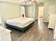 Large bedroom with adjacent ensuite bathroom, ceiling fan, and neutral paint at 9790 66Th N St # 321, Pinellas Park, FL 33782