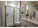 Updated bathroom features a modern shower, vanity and sink with a marble countertop at 10267 Fieldstone Myrtle Way, San Antonio, FL 33576