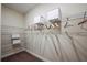 Walk-in closet features lots of shelving and storage for clothes and boxes at 10267 Fieldstone Myrtle Way, San Antonio, FL 33576