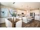 Bright kitchen and dining area with stainless steel appliances, island with seating, and modern finishes at 10267 Fieldstone Myrtle Way, San Antonio, FL 33576