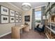 Home office features a modern desk, contemporary decor and a window view to the neighborhood at 10267 Fieldstone Myrtle Way, San Antonio, FL 33576