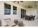 Covered patio featuring a ceiling fan, comfortable lounge seating, and a cozy atmosphere at 10267 Fieldstone Myrtle Way, San Antonio, FL 33576