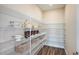 Walk-in pantry featuring ample wire shelving for organized storage of food and kitchen essentials at 10267 Fieldstone Myrtle Way, San Antonio, FL 33576