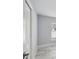 Bedroom features a closet, tile flooring, and is illuminated by natural light at 104 1St Ne Ave, Lutz, FL 33549