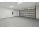Spacious two-car garage with painted walls and floor at 104 1St Ne Ave, Lutz, FL 33549