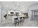 Bright, modern kitchen with white cabinetry, stainless appliances, and an island with barstool seating at 104 1St Ne Ave, Lutz, FL 33549