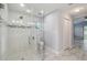 Bright bathroom featuring a glass shower with mosaic tile accents at 104 1St Ne Ave, Lutz, FL 33549