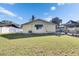 Lush backyard featuring a hammock and verdant grass at 10719 Drummond Rd, Tampa, FL 33615