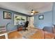 The home office is illuminated by natural light and features a ceiling fan at 10719 Drummond Rd, Tampa, FL 33615