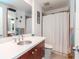 Clean bathroom with a modern vanity, ample counter space, and a shower with a curtain at 1208 E Kennedy Blvd # 1122, Tampa, FL 33602