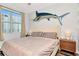 Serene bedroom with a comfortable bed, ample natural light, and a stylish accent wall featuring a marlin decoration at 1208 E Kennedy Blvd # 1122, Tampa, FL 33602