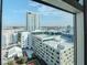 Expansive city view showcasing a rooftop pool, nearby buildings, and the distant cityscape at 1208 E Kennedy Blvd # 1122, Tampa, FL 33602
