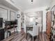 Open-concept living and dining area with modern lighting, wood floors, and stylish decor at 1208 E Kennedy Blvd # 1122, Tampa, FL 33602