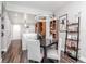 Open-concept living and dining area with modern lighting, wood floors, and stylish decor at 1208 E Kennedy Blvd # 1122, Tampa, FL 33602