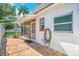 Brick back porch with screened room and view of the fenced back yard of the property at 12310 Mallory Dr, Largo, FL 33774