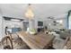 Inviting dining area flows into the living room, featuring modern decor and a cozy atmosphere at 12310 Mallory Dr, Largo, FL 33774