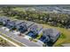 Beautiful aerial view of a residential neighborhood with manicured lawns and green spaces at 14733 Gallop Run Dr, Lithia, FL 33547