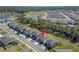 Beautiful aerial view of the neighborhood featuring a pond and community recreation area at 14733 Gallop Run Dr, Lithia, FL 33547