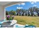 The property boasts a large backyard with green grass and plenty of natural light at 14733 Gallop Run Dr, Lithia, FL 33547