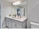 Bright bathroom featuring double sinks, quartz countertops, and modern fixtures at 14733 Gallop Run Dr, Lithia, FL 33547