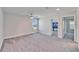 Open bedroom featuring plush carpet, neutral walls and a ceiling fan at 14733 Gallop Run Dr, Lithia, FL 33547
