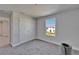 Empty bedroom featuring a double closet, natural light, and a neutral color palette at 14733 Gallop Run Dr, Lithia, FL 33547