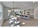 Open dining area and kitchen with stainless steel appliances and lots of natural light at 14733 Gallop Run Dr, Lithia, FL 33547