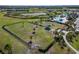 Aerial shot of a fenced dog park featuring mature trees, a gazebo and a walking path at 14733 Gallop Run Dr, Lithia, FL 33547