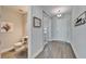 Hallway with half bath and front door at 14733 Gallop Run Dr, Lithia, FL 33547