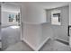Hallway with carpeted steps and a view into an adjacent bedroom at 14733 Gallop Run Dr, Lithia, FL 33547