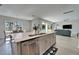 Kitchen with a view to the dining room, living room and sliding doors to the outside at 14733 Gallop Run Dr, Lithia, FL 33547