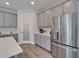 Modern kitchen featuring stainless steel appliances and white cabinets at 14733 Gallop Run Dr, Lithia, FL 33547