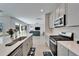 Kitchen with stainless steel appliances, a range with white countertops and cabinets at 14733 Gallop Run Dr, Lithia, FL 33547