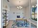 Bright office with desk, chair, shelving and a view at 14733 Gallop Run Dr, Lithia, FL 33547