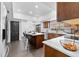 Well-lit kitchen with a central island, stainless steel appliances, and eat in dining area at 15703 Jericho Dr, Odessa, FL 33556