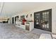 Outdoor kitchen area featuring modern stainless steel appliances and a red smoker at 15703 Jericho Dr, Odessa, FL 33556