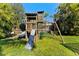 Fun backyard playground with a slide, swing, and climbing structure for  at 15703 Jericho Dr, Odessa, FL 33556