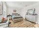 Bedroom with wood floors and a silver decorative bed at 16946 Oval Rum Dr., Wimauma, FL 33598