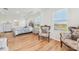 Bright bedroom with a large window, wood floors, and luxurious decor at 16946 Oval Rum Dr., Wimauma, FL 33598