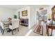 Spacious dining area featuring an elegant table with seating for six and access to other living spaces at 16946 Oval Rum Dr., Wimauma, FL 33598