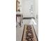 Inviting foyer with tiled floor, elegant console table and decor, leading to the rest of the home at 16946 Oval Rum Dr., Wimauma, FL 33598