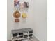 Organized mudroom with shoe storage bench and coat hooks, ideal for keeping entryways tidy and functional at 16946 Oval Rum Dr., Wimauma, FL 33598