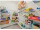 Spacious walk-in pantry with metal shelving, providing ample storage for food and household items at 16946 Oval Rum Dr., Wimauma, FL 33598