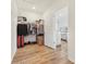 Organized walk-in closet with a variety of clothing and storage options at 16946 Oval Rum Dr., Wimauma, FL 33598